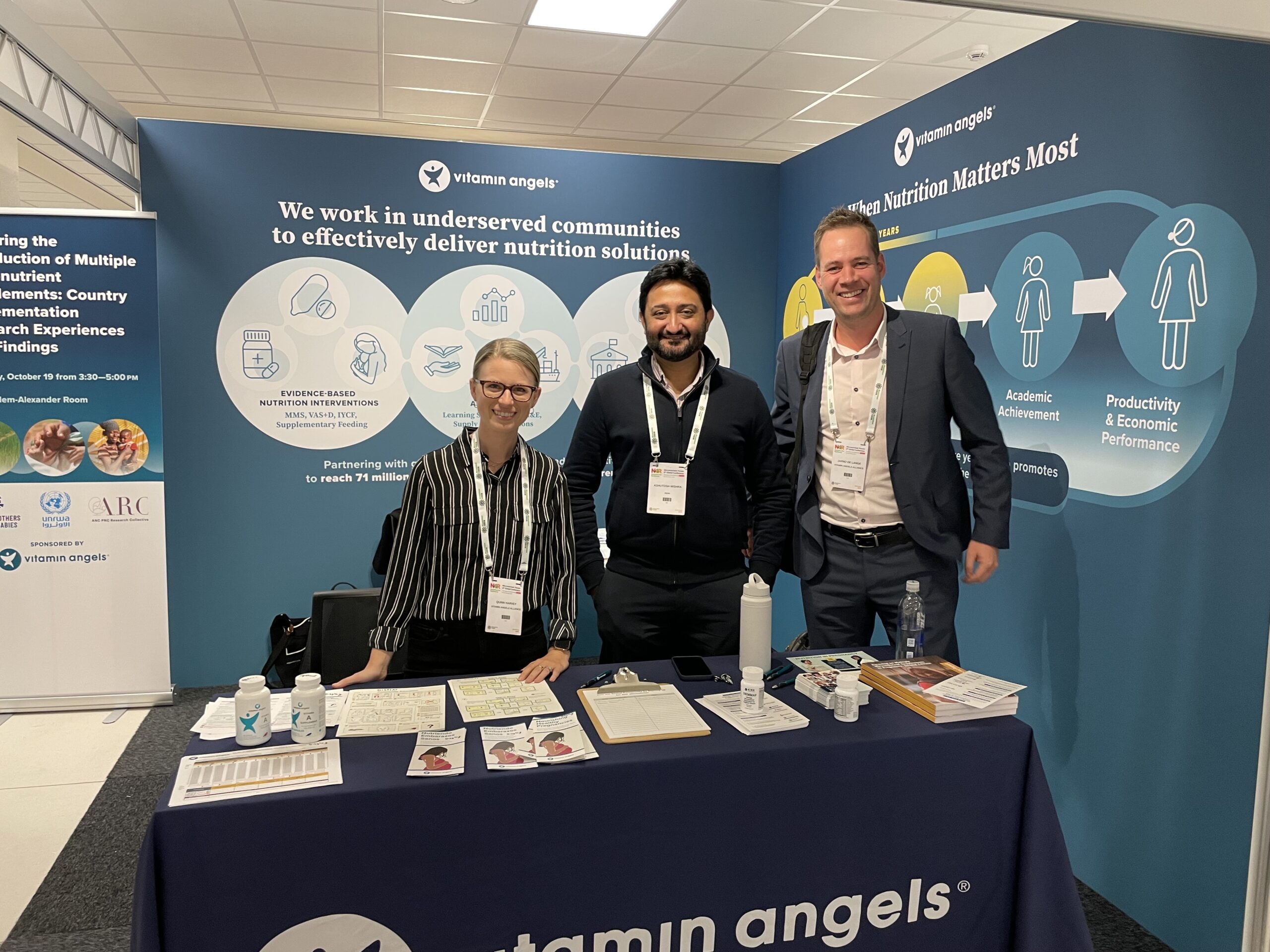 Vitamin Angels staff at a booth at the Micronutrient Forum Nutrition for Resilience Conference 2023