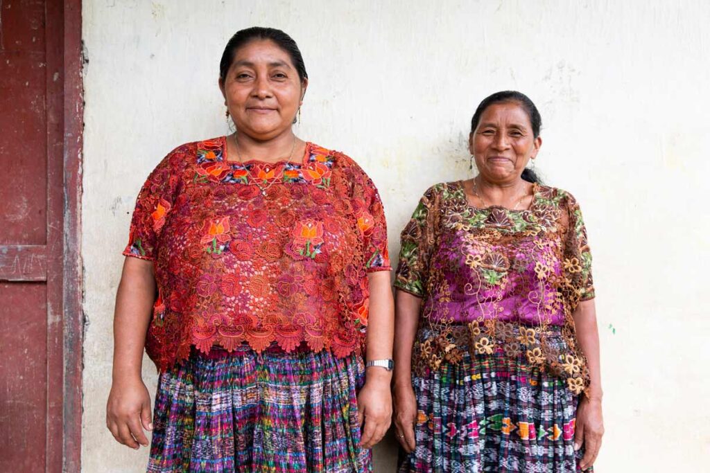 Two comadronas stand side-by-side in Guatemala.