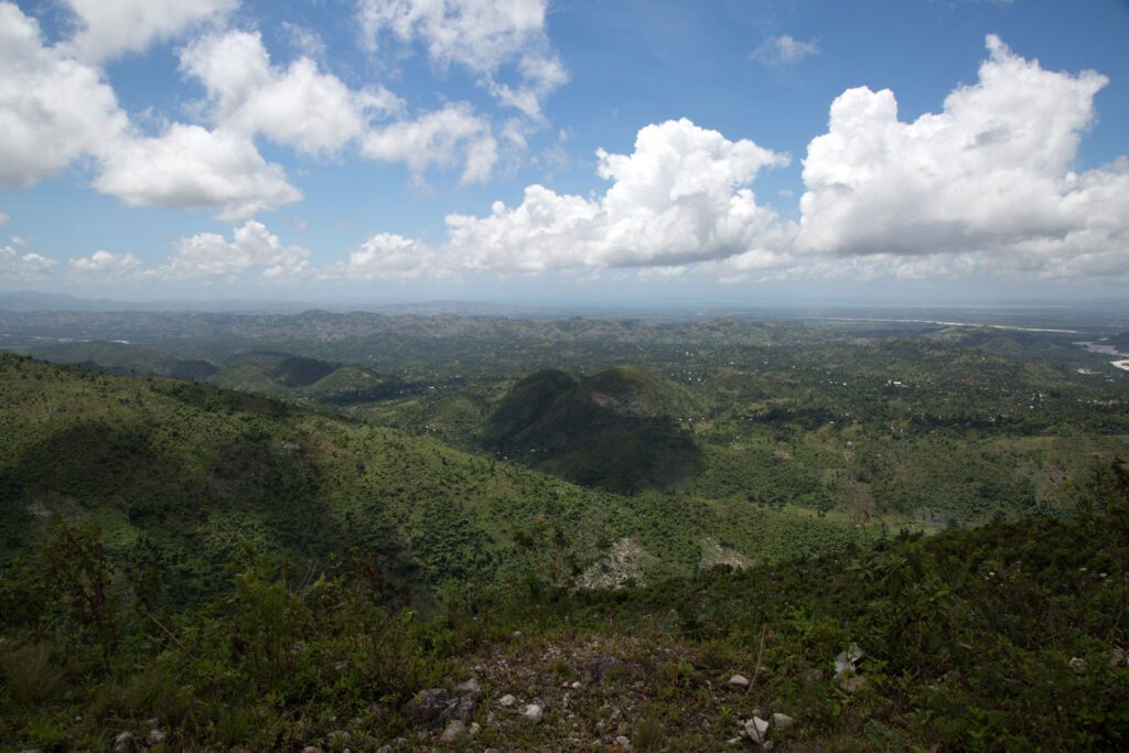 Scenic view of Haitian forest with cloudy skies.